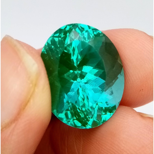 1366 - An 22ct Attractive Blue/Green Tourmaline Gemstone. Oval cut with a trillion base. Well faceted. No v... 