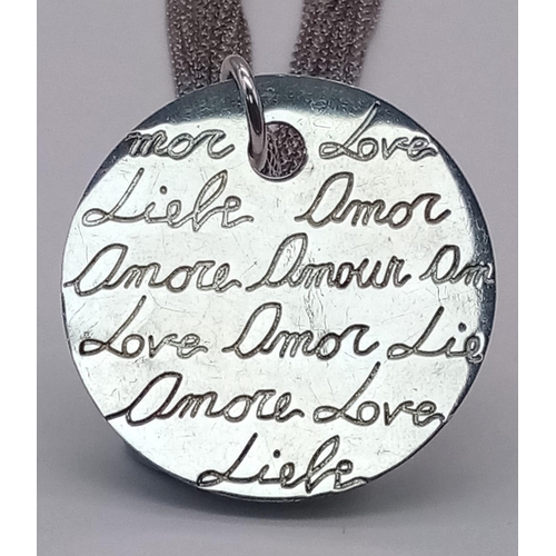 1149 - A sterling silver multi-strand chain necklace with a round pendant with the word LOVE in many langua... 