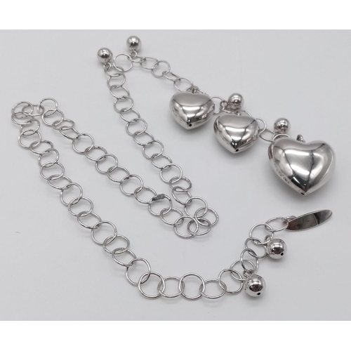 1163 - A sterling silver, necklace loaded with hearts. Total weight: 38.8 g. Perfect as a St valentine's pr... 