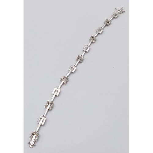 247 - A 9K WHITE GOLD DIAMOND SET BRACELET. 9.9G