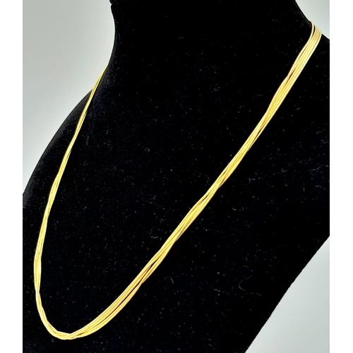 58 - A very feminine, 9 K yellow gold, four chain necklace.  length: 43 cm, weight: 9 g.