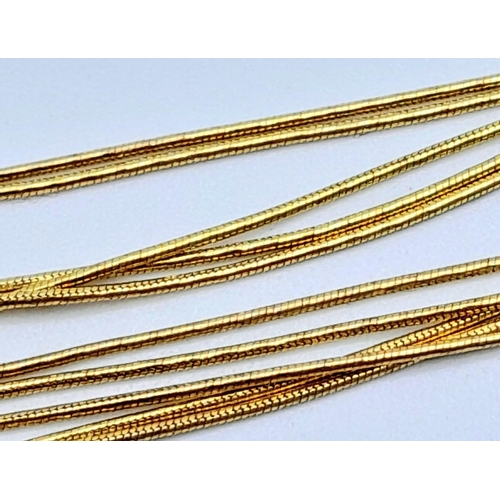 58 - A very feminine, 9 K yellow gold, four chain necklace.  length: 43 cm, weight: 9 g.