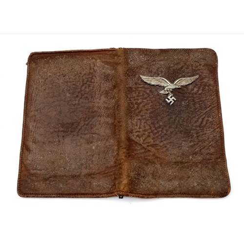 692 - WW2 Luftwaffe Airman’s Wallet. The Eagle badge is from a tropical helmet.