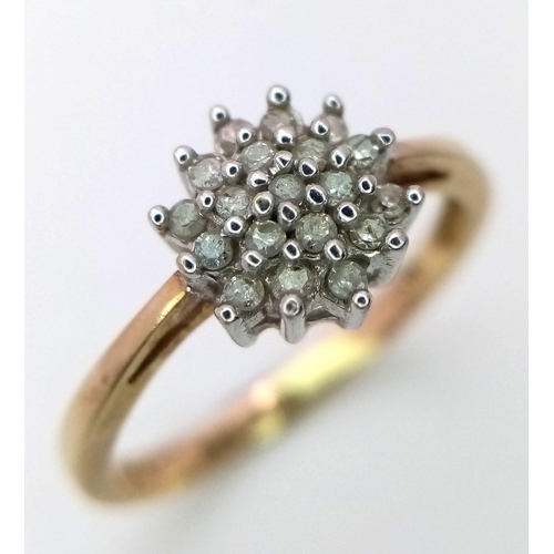 801 - AN 9K YELLOW GOLD DIAMOND CLUSTER RING. 1.6G. SIZE L.