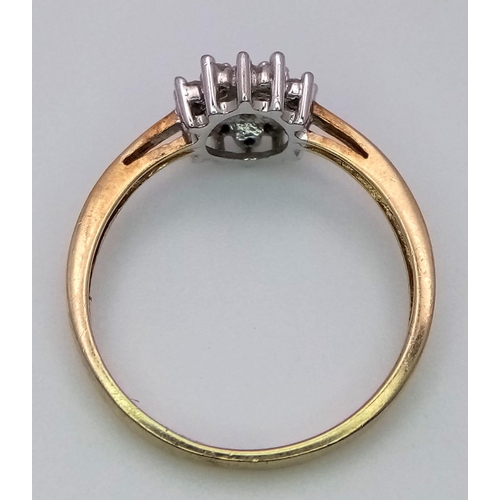 801 - AN 9K YELLOW GOLD DIAMOND CLUSTER RING. 1.6G. SIZE L.