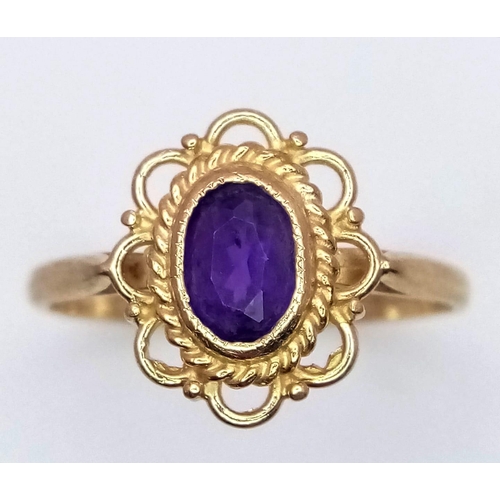 829 - A 9K YELLOW GOLD AMETHYST RING. 1.4G SIZE K