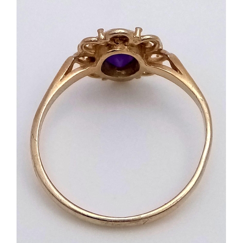 829 - A 9K YELLOW GOLD AMETHYST RING. 1.4G SIZE K