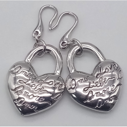 1235 - A pair of sterling silver heart earrings with the word LOVE in many languages. Drop: 5 cm, total wei... 