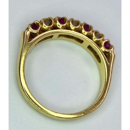 12 - A 9 K yellow gold ring with round cut rubies alternating with round cut diamonds. Ring size: J, weig... 