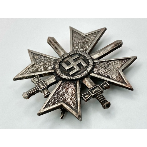 127 - 3rd Reich German War Merit Cross First Class with Swords, die-struck construction in zinc with silve... 