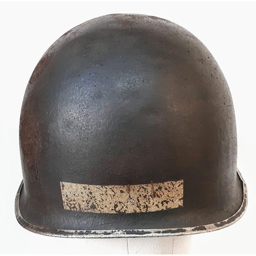 13 - WW2 US Fixed Bale M1 Helmet, with insignia of the 90th Infantry Division.