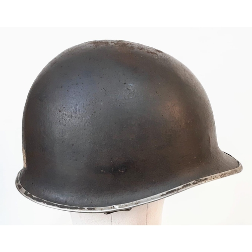 13 - WW2 US Fixed Bale M1 Helmet, with insignia of the 90th Infantry Division.