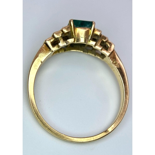 16 - A 9 K yellow gold ring with an emerald cut emerald and round cut diamonds on the solders. Ring size:... 