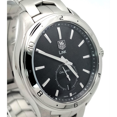 17 - A Tag Heuer Link Calibre 6 Automatic Watch. Stainless steel bracelet and case - 41mm. Black dial wit... 