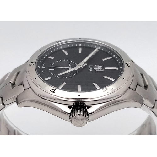 17 - A Tag Heuer Link Calibre 6 Automatic Watch. Stainless steel bracelet and case - 41mm. Black dial wit... 