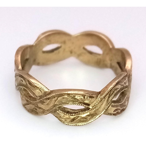 219 - A 9 K yellow gold ring of two bands crossing over each other.  Size: G, weight: 2 g.