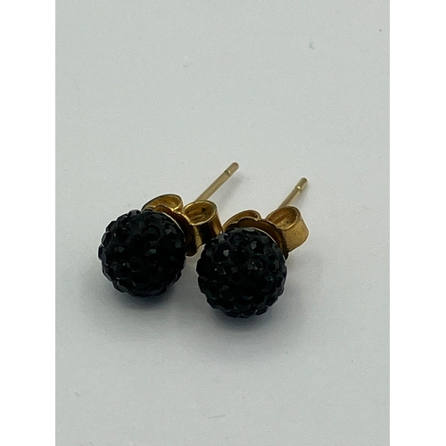 225 - 9 carat GOLD and BASALT GLOBE EARRINGS. Complete with Gold Backs. 1.07 grams.