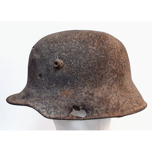 251 - WW1 Battle Damaged German M16 Stahlhelm Helmet. This helmet was found in woodland in the Ypres Salie... 