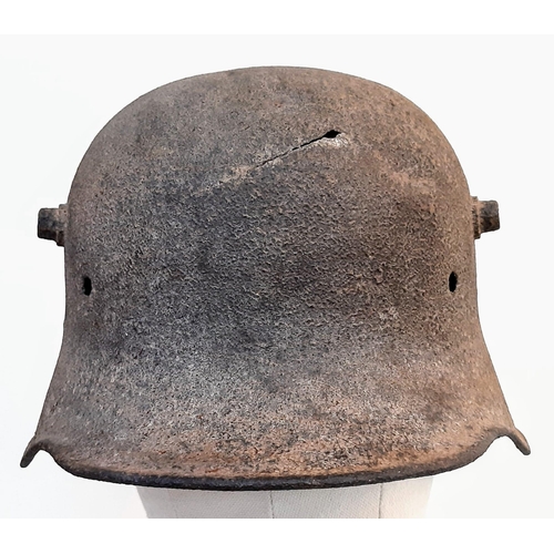 251 - WW1 Battle Damaged German M16 Stahlhelm Helmet. This helmet was found in woodland in the Ypres Salie... 