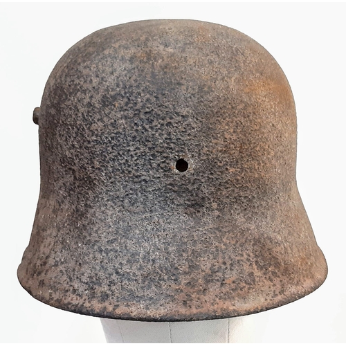 251 - WW1 Battle Damaged German M16 Stahlhelm Helmet. This helmet was found in woodland in the Ypres Salie... 