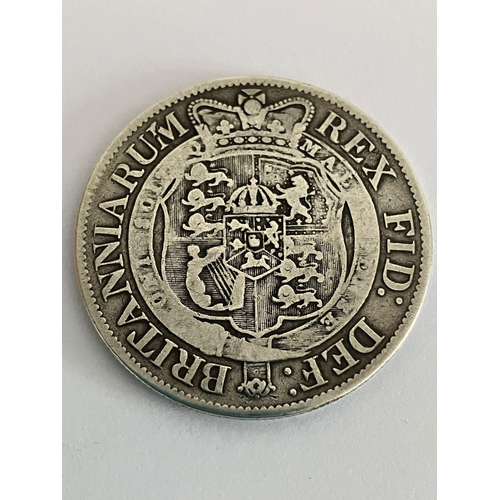 63 - 1818 GEORGE III SILVER HALF CROWN in very fine condition. Having clear detail and wording to both si... 