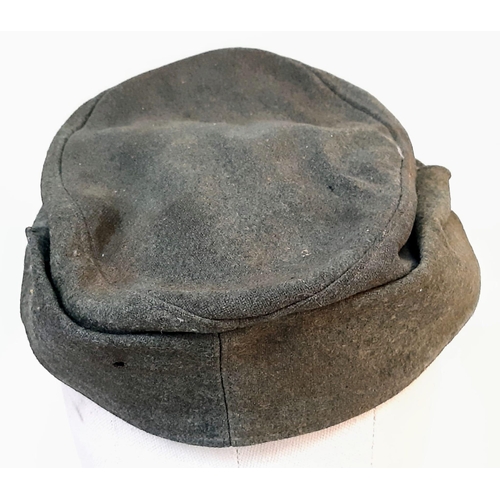 64 - 3rd Reich Waffen SS M43 Cap. very small cut on the top. A real “Been There” item.