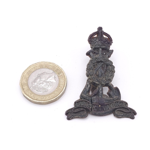 828 - WW2 British Economy Issue Plastic Cap Badge. Royal Pioneer Corps.