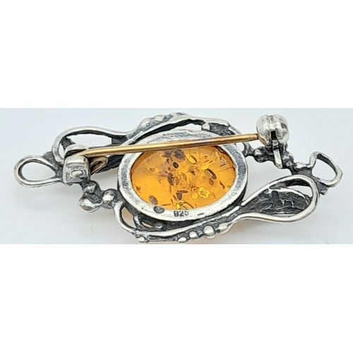 906 - A Vintage Sterling Silver Amber Cabochon Bar Brooch. 3.7cm length. Set with a 1.5cm amber cabochon. ... 