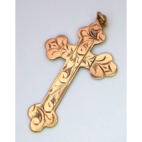 233 - A 9 K yellow gold cross pendant, dimensions: 27 x 18 mm, weight; 1 g.