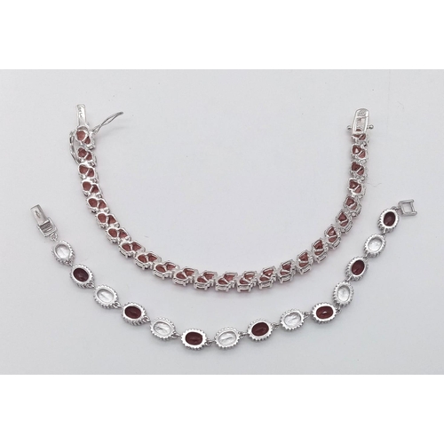 947 - Two Red Gemstone Silver Tennis Bracelets. 17 and 19cm. 36g total weight.