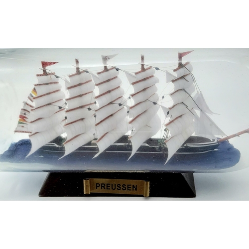 777 - A Ship in a Bottle. Good condition in original packaging. 30cm length.