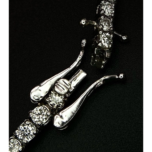 10 - An 18K White Gold Diamond Tennis Bracelet. 62 brilliant round cut diamonds - 4.3ctw. 18cm. 8.2g tota... 