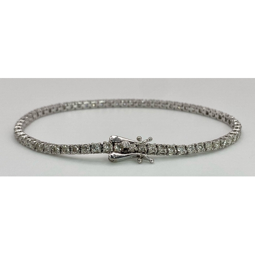 10 - An 18K White Gold Diamond Tennis Bracelet. 62 brilliant round cut diamonds - 4.3ctw. 18cm. 8.2g tota... 