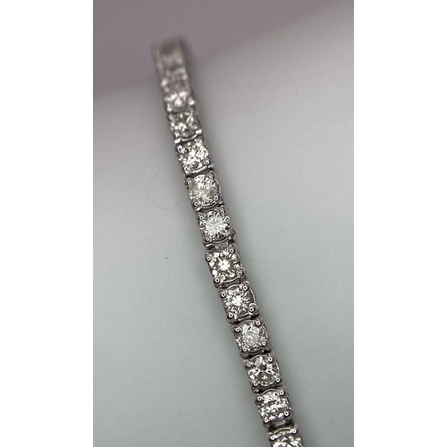 10 - An 18K White Gold Diamond Tennis Bracelet. 62 brilliant round cut diamonds - 4.3ctw. 18cm. 8.2g tota... 