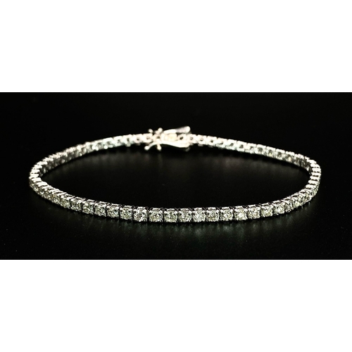 10 - An 18K White Gold Diamond Tennis Bracelet. 62 brilliant round cut diamonds - 4.3ctw. 18cm. 8.2g tota... 