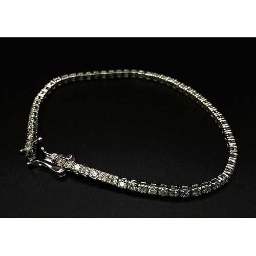 10 - An 18K White Gold Diamond Tennis Bracelet. 62 brilliant round cut diamonds - 4.3ctw. 18cm. 8.2g tota... 