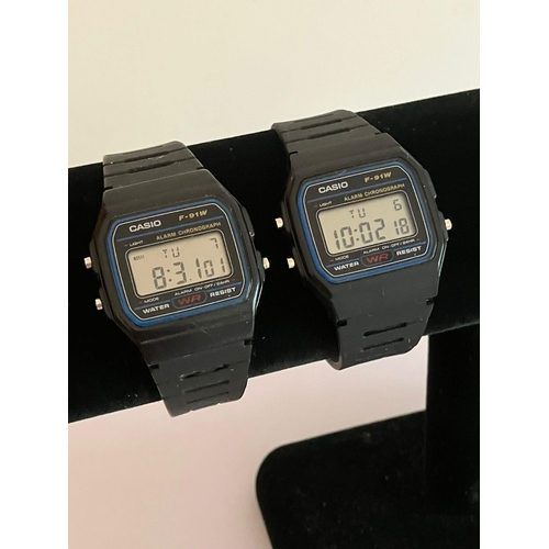 1064 - 2 x CASIO DIGITAL f 91W Wristwatches. Water resistant with rubber diver straps. Full working order.