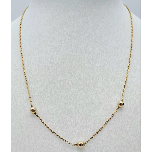 108 - A very attractive, 9 K yellow gold chain necklace with golden balls and a pair of matching earrings.... 