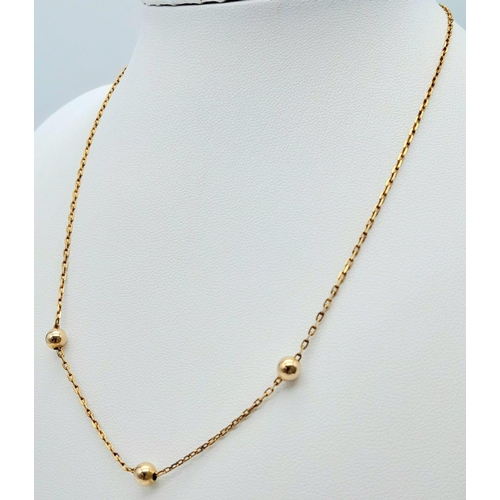 108 - A very attractive, 9 K yellow gold chain necklace with golden balls and a pair of matching earrings.... 