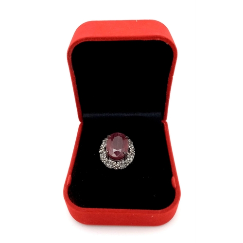 1080 - A Ruby and Diamond Gemstone Ring set in 925 Silver. Central 8ct ruby with a double row 0.80ctw diamo... 