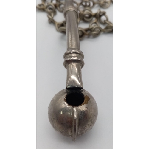 1289 - A WW2 Naval Bosuns Whistle on metal chain lanyard. Marked with a Broad Arrow. 12cm Length.