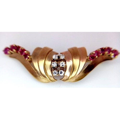 129 - A  vintage, 9 K yellow gold brooch with round cut rubies and white sapphires. Dimensions: 44 x 14 x ... 