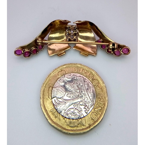 129 - A  vintage, 9 K yellow gold brooch with round cut rubies and white sapphires. Dimensions: 44 x 14 x ... 