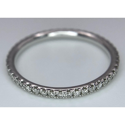 220 - An 18K White Gold Diamond Half Eternity Ring. Size M. 1.55g total weight.