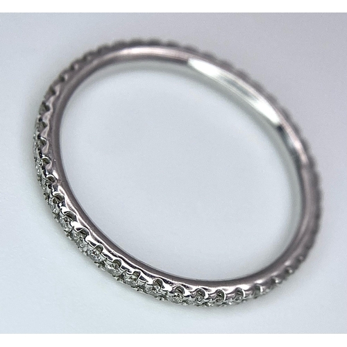 220 - An 18K White Gold Diamond Half Eternity Ring. Size M. 1.55g total weight.