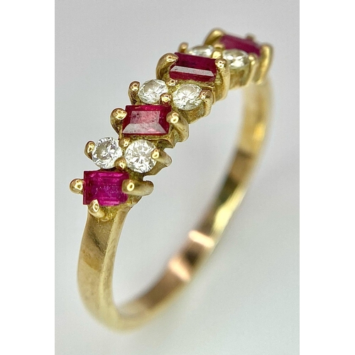 415 - A 9K YELLOW GOLD DIAMOND & RUBY RING. 1.9G. SIZE P.