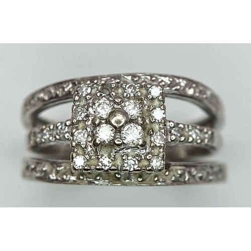 436 - A 9K White Gold Diamond Three-Level Cluster Ring. Size I. 3.7g total weight.