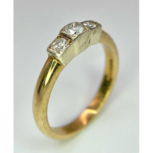 452 - A 9K YELLOW GOLD TRILOGY DIAMOND RING. 0.30CT. 2.8G SIZE M
