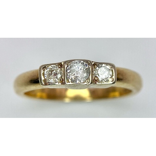 452 - A 9K YELLOW GOLD TRILOGY DIAMOND RING. 0.30CT. 2.8G SIZE M