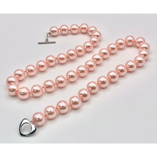 463 - A Metallic Pink South Sea Pearl Shell Bead Necklace. 12mm beads. 55cm necklace length.